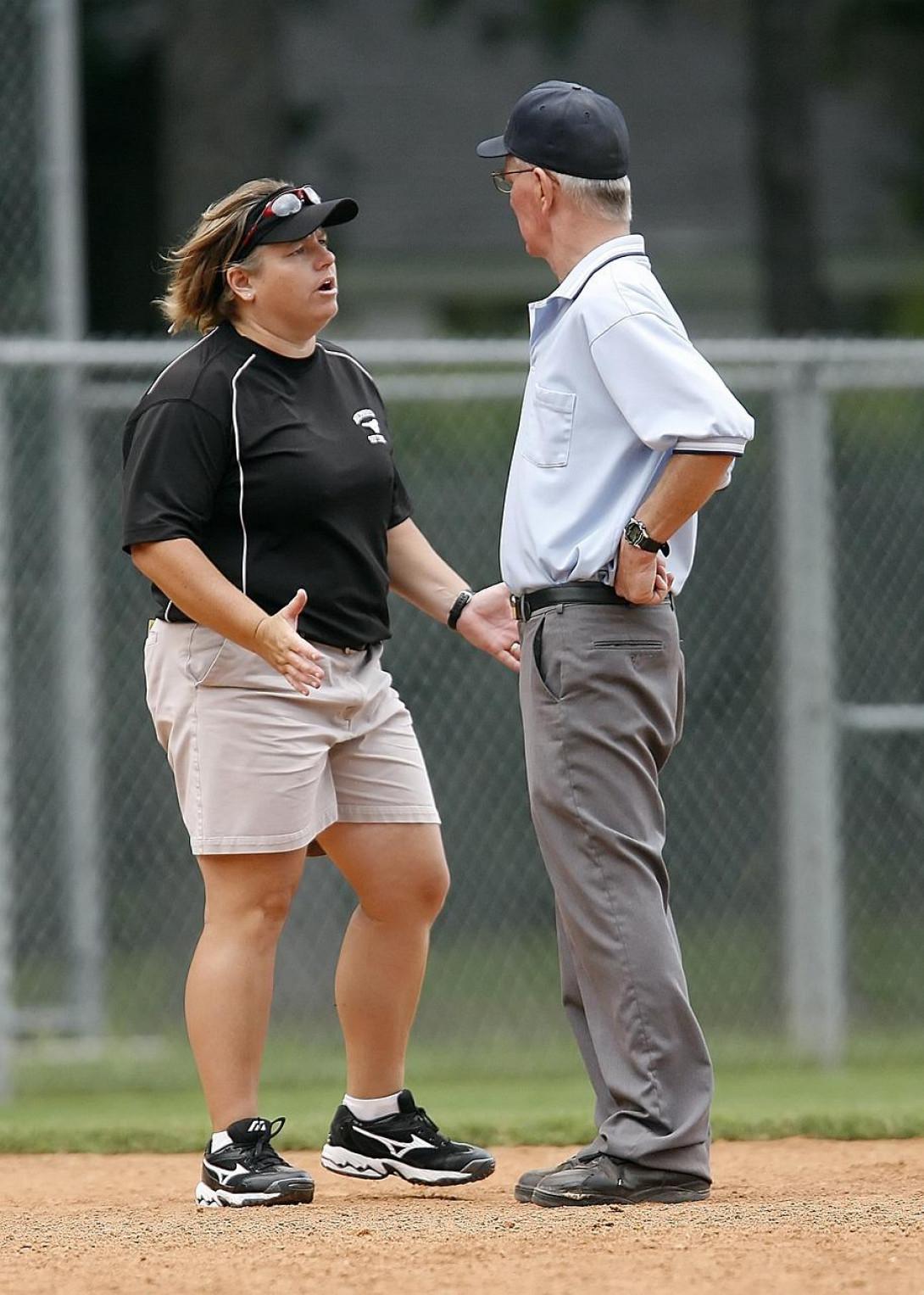 coach and Umpire discussing a call